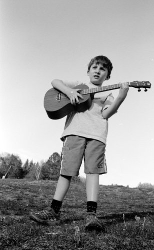 Benjamin-playing-Guitar-in-Field-PS.jpg